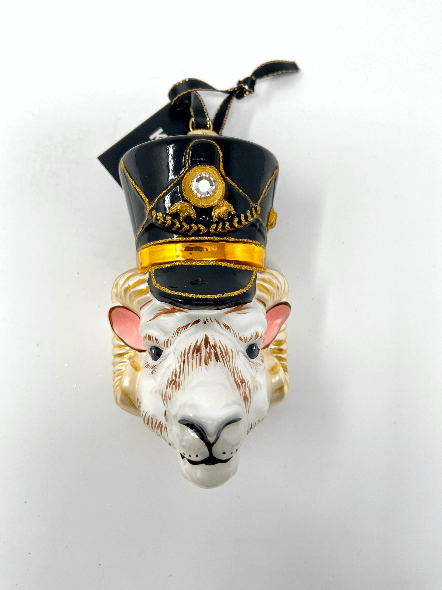 Ram head with nutcracker black cap and gold detailing. Polish glass christmas ornaments in saturated colors.