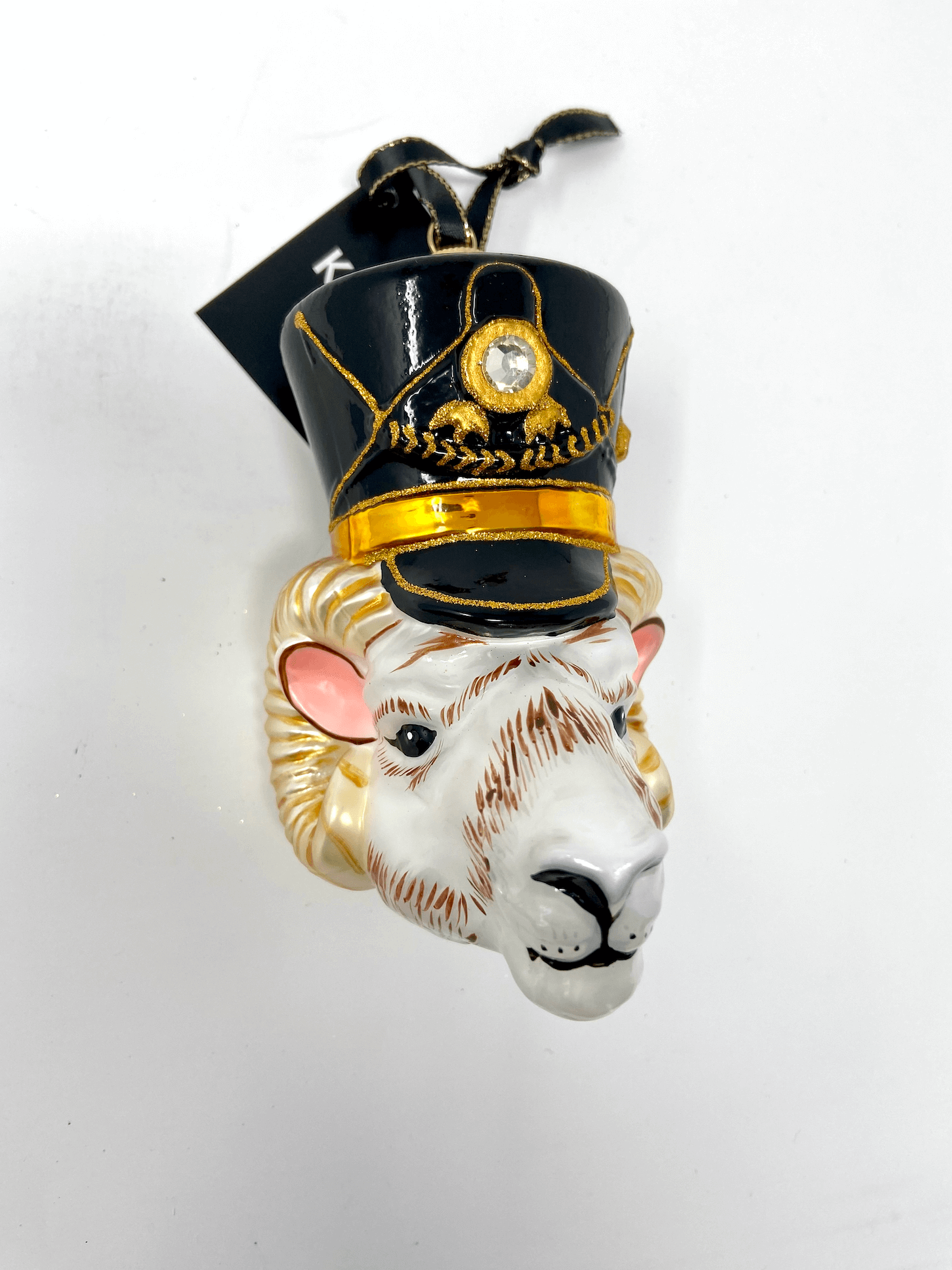 Ram head with nutcracker black cap and gold detailing. Polish glass christmas ornaments in saturated colors.