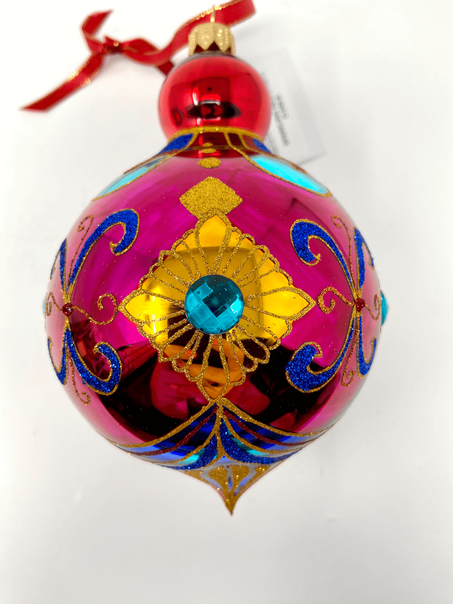 Gorgeously intricately detailed colorful polish glass ornament with gold detailing and colorful accents.