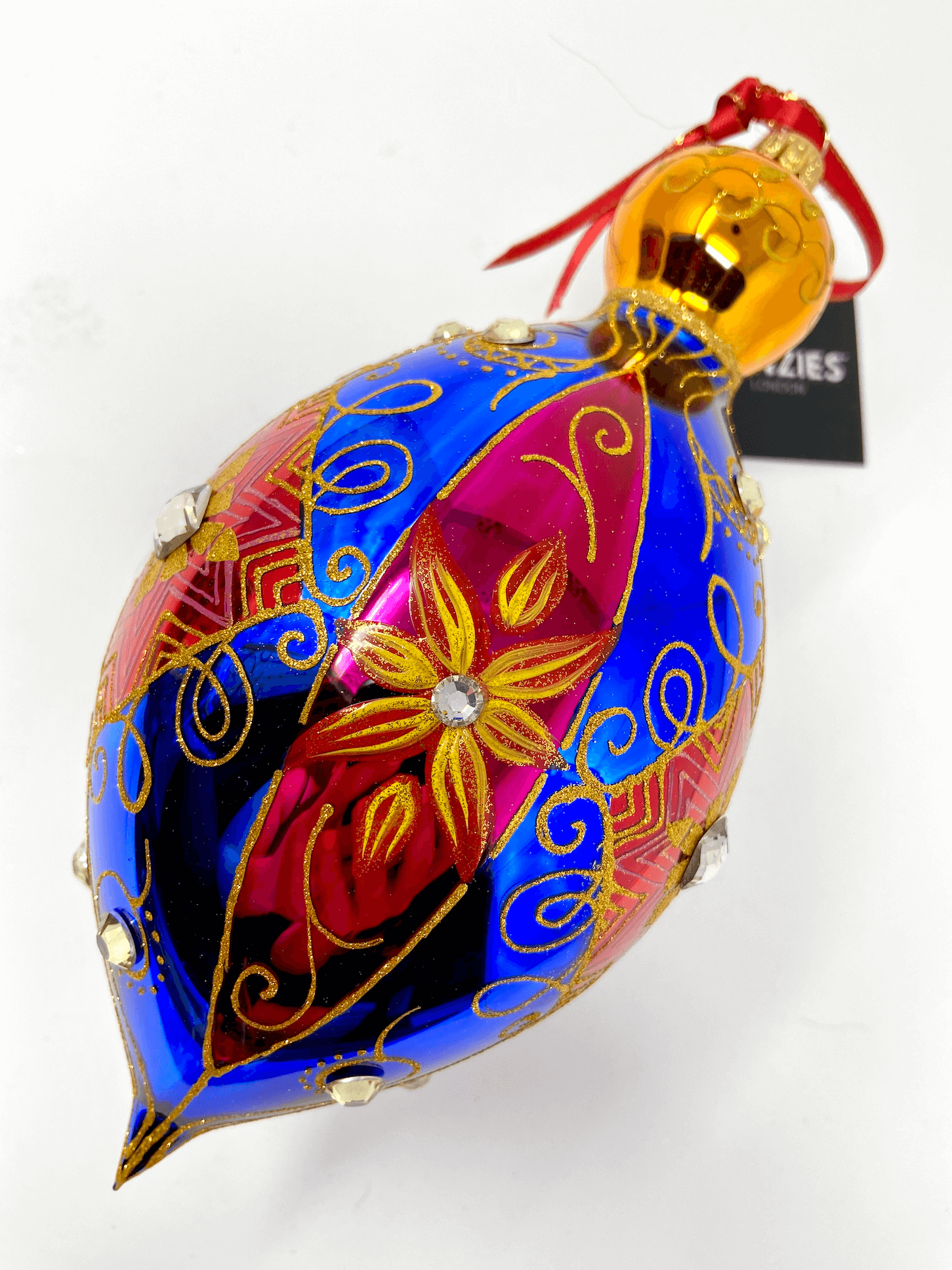 Generously oversized polish glass christmas ornament bauble decorated in blue and red stripes with gold damask detailing.