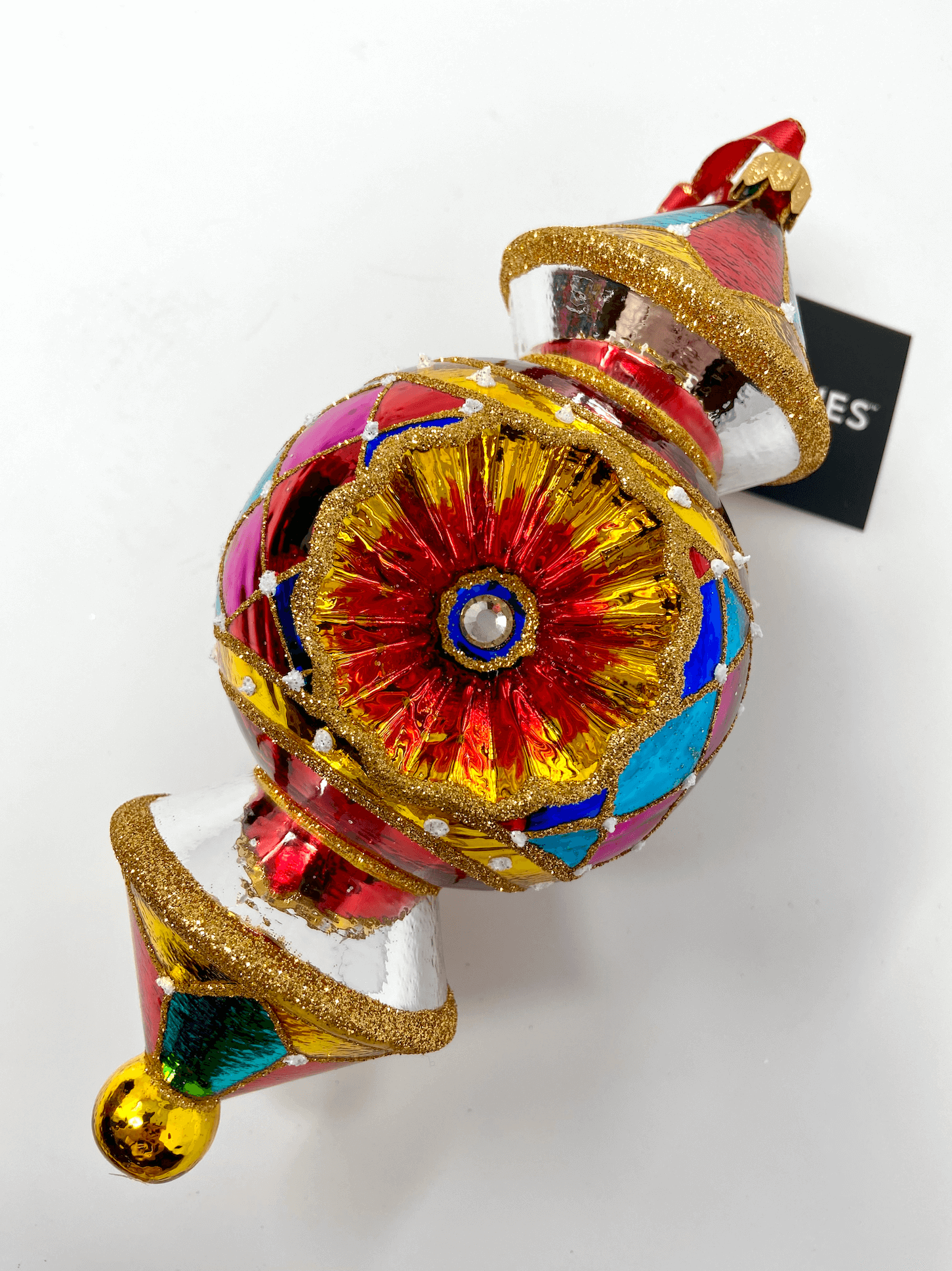 beautiful triple-barrel reflector glass ornament with colorful patterns and gold detailing. Polish glass christmas ornaments in saturated colors.