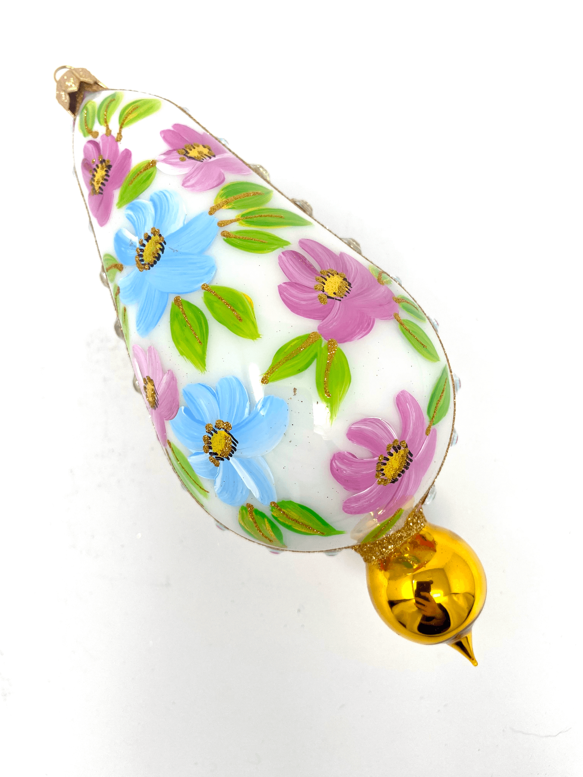 White eggplant shaped ornament featuring gemstones, intricate gold detailing, and hand painted floral blooms. A Christmas polish glass ornament. Floral Escape Floral Fetish.