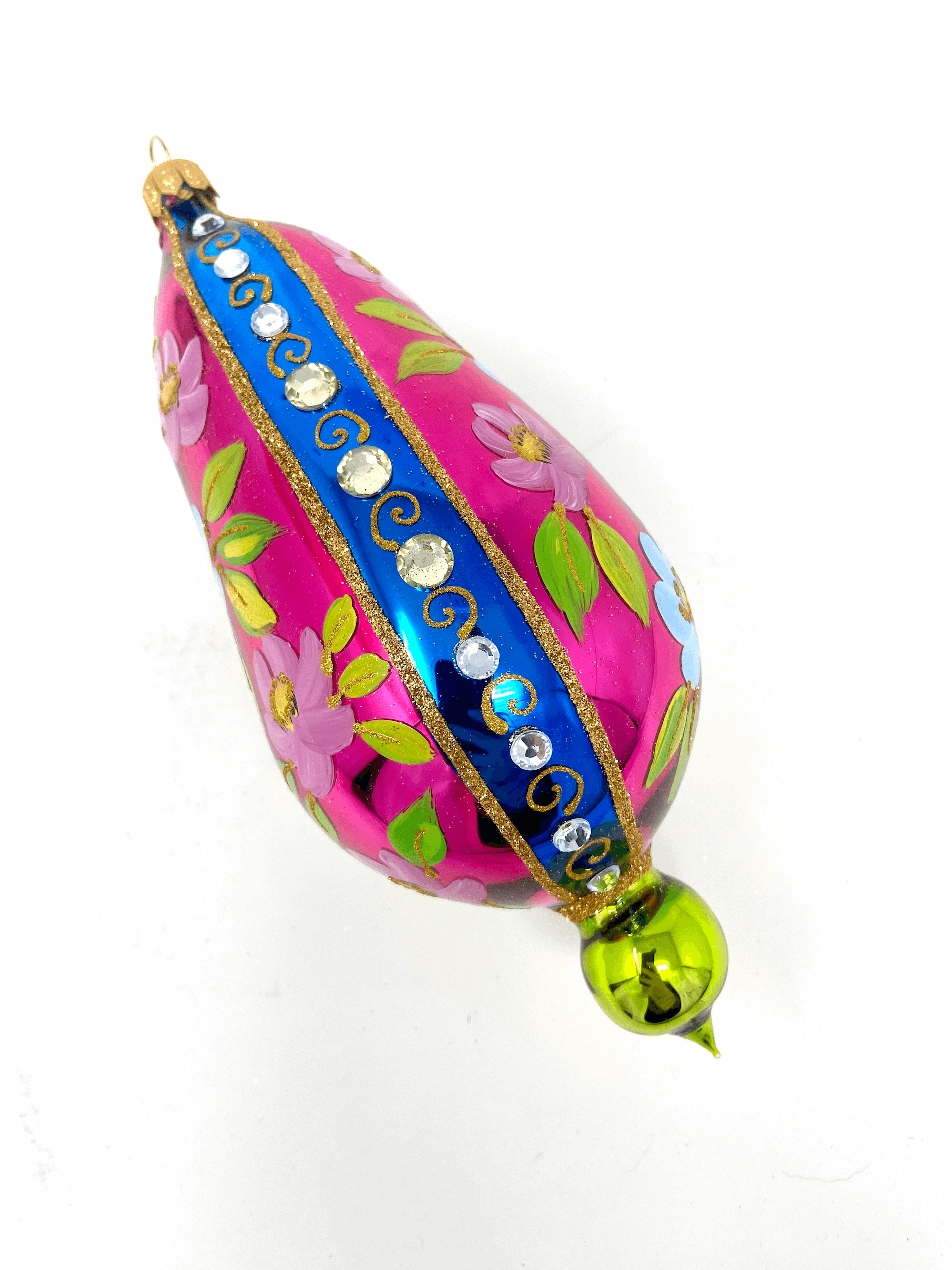 Pink eggplant shaped ornament featuring gemstones, intricate gold detailing, and hand painted floral blooms. A Christmas polish glass ornament. Floral Escape Floral Fetish.